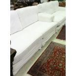 A pair of modern white upholstered three seat sofas CONDITION REPORTS Both sofas are