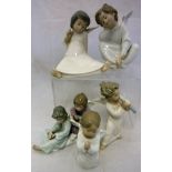 A collection of eight assorted Lladro figurines of cherubs (8)
