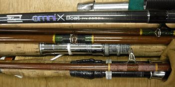 A collection of five assorted fishing rods to include two sea fishing rods,