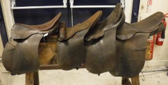 Four leather general purpose saddles