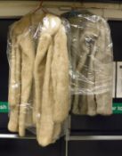 A pale mink three-quarter length coat with satin lining,