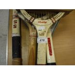 A collection of various sporting items to include hockey sticks, vintage tennis rackets,