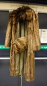 A full length coat be Steinbruck of Hamburg with matching headband,