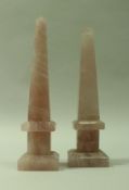 A near-matching pair of rose quartz obelisks