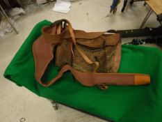 A Brady leather trimmed canvas gun sleeve and a leather trimmed canvas fishing bag