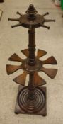 A 19th Century mahogany whip rack boot stand with ringed and turned central column,