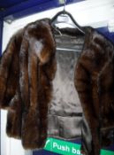 A collection of furs comprising a dark brown mink jacket, inscribed "Bradleys" to the interior,