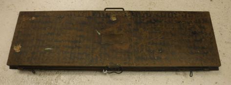A Victorian painted tin travel case bearing brass plaques inscribed "H Poole & Co.