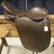 A general purpose saddle with leather tree, together with a box of assorted horse rugs, etc.