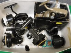 A collection of five fixed spool fishing reels to include a Mitchell 300, another Mitchell 300,