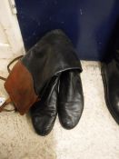 A pair of black leather racing boots with mahogany tops, size 9,