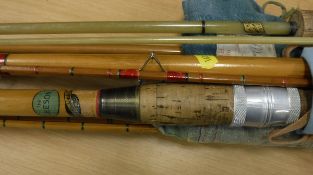 A collection of four fishing rods to include a three piece cane and split cane rod a Leeson rod by