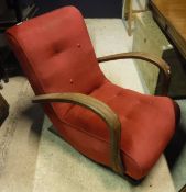 A 1930s open-arm buttoned red upholstered rocking chair together with two framed prints