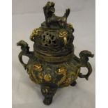 A Chinese relief work bronze and gilded koro with exotic beast and dragon decoration,