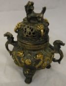 A Chinese relief work bronze and gilded koro with exotic beast and dragon decoration,