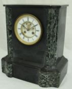 A Victorian black slate and marble cased mantle clock with visible escapement