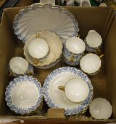 A 19th Century Coalport pot tea service with blue coral decoration and gilt handles in the form of