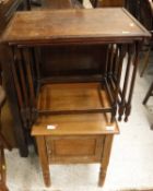 A pine single door pot cupboard on turned supports, a nest of three mahogany occasional tables,