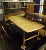 An Ercol elm coffee table together with an Ercol glazed sideboard