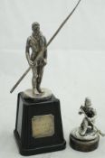 A silver figure of a soldier with rifle, bears makers mark "TS", other marks rubbed,