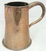 A 19th Century copper jug of large proportions,