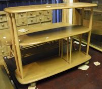An Ercol elm two tier bookcase CONDITION REPORTS Condition basically sound.