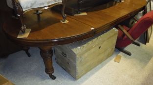 A late Victorian oak D-end extending dining table,