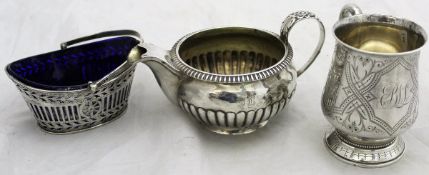 A Victorian silver mug of typical form with engraved floral decoration,