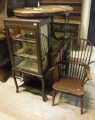 An Edwardian mahogany display cabinet together with a Victorian burr walnut oval table,