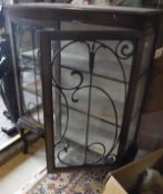 An Edwardian mahogany and inlaid display cabinet with fretwork decorated doors raised on cabriole