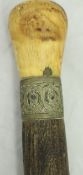 A Victorian wooden and white metal mounted baton with baluster shaped carved ivory finials