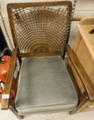Two cane back chairs together with a washstand,