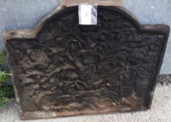 A Victorian cast iron fire back decorated with fruiting tree and bearing initials "CR" (for Charles