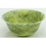 A Chinese jade bowl of flared form,