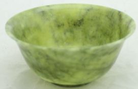 A Chinese jade bowl of flared form,