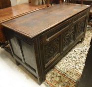 A circa 1700 oak coffer, the top opening to reveal a plain interior,