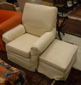 A "Multi-York" armchair and footstool with cream floral upholstery