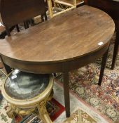 A 19th Century mahogany demi lune side table raised on square tapering legs together with an early