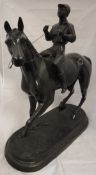 A bronze figure of a horse and jockey,