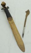 A Victorian walnut and ebonised paperknife of fiddle-neck form,