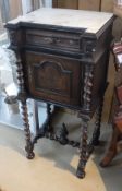 A stained oak pot cupboard with marble top and carved cupboard door to barley twist and stretchered