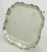 A George V silver salver of plain form with pie-crust edge,