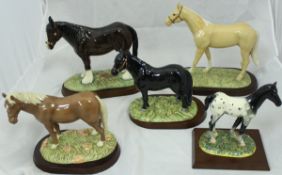 A collection of five Royal Doulton horse figures including "Appaloosa foal" (RDA35),