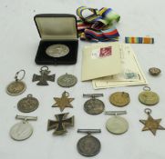 A collection of medals, ribbons etc to include a 1914-1918 War medal and 1914-18 Victory medal,