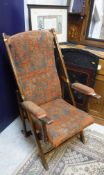 A Victorian campaign chair together with an ebonised fire screen with inlaid mother of pearl