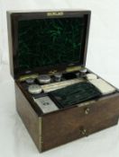 A 19th Century burr walnut and brass bound ladies travelling vanity case,