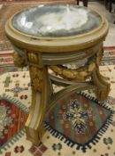 A 19th Century circular occassional table with mirrorred top above painted and gilded urn stand