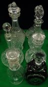 An early 20th Century dark green glass overlaid decanter of oval form,