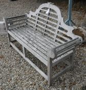 A modern teak Lutyens style garden bench