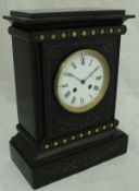 A black slate cased mantle clock with painted decoration